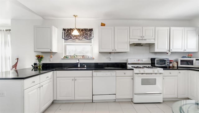 kitchen with sink, white cabinetry, hanging light fixtures, kitchen peninsula, and white appliances