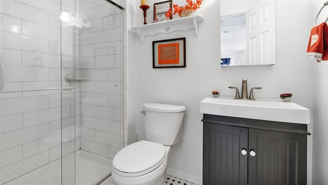 bathroom with vanity, an enclosed shower, and toilet