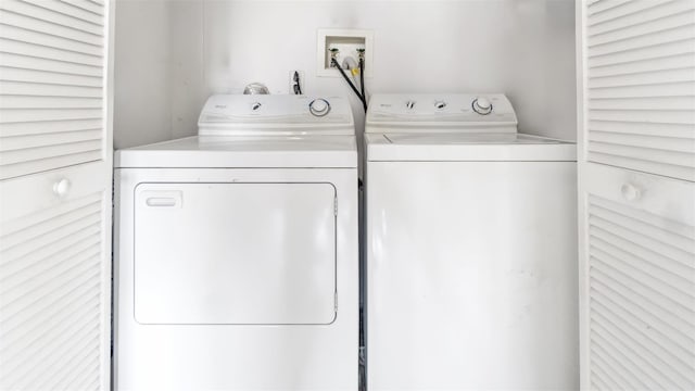 clothes washing area with independent washer and dryer