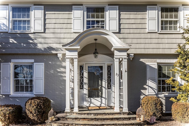 property entrance with brick siding