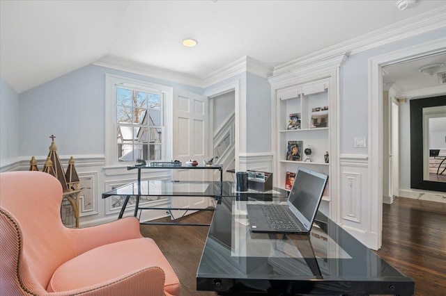 office space with ornamental molding, vaulted ceiling, dark hardwood / wood-style floors, and built in shelves