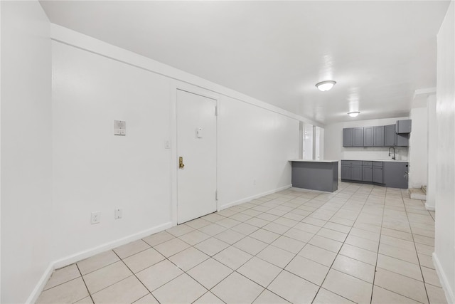 interior space featuring sink and light tile patterned floors