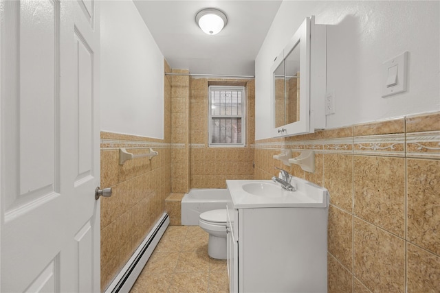 full bathroom featuring a baseboard radiator, tile walls, tile patterned flooring, vanity, and toilet