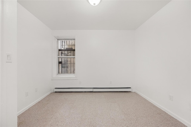 unfurnished room featuring a baseboard radiator