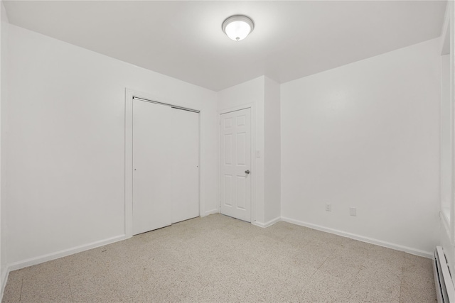 spare room with a baseboard heating unit