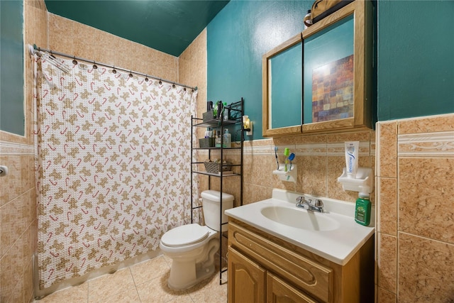 bathroom with tile walls, tile patterned flooring, vanity, walk in shower, and toilet