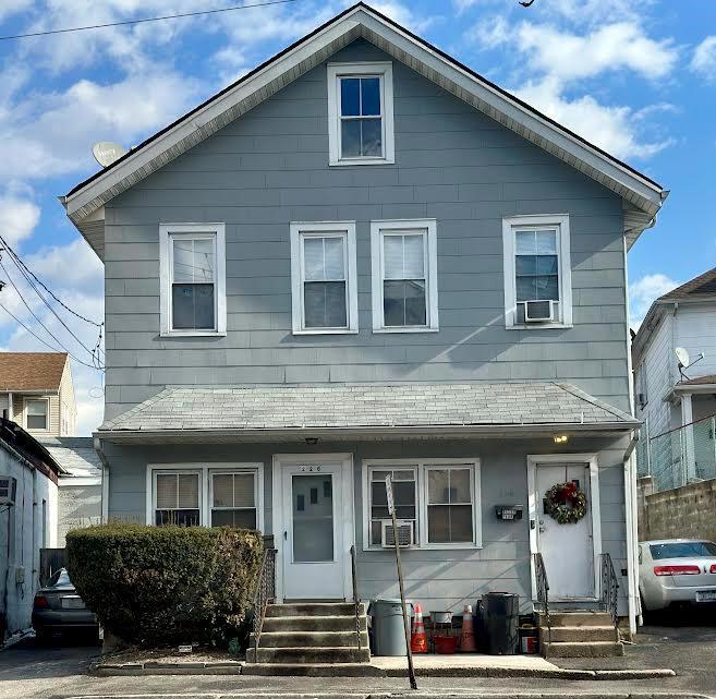 view of front of home featuring cooling unit