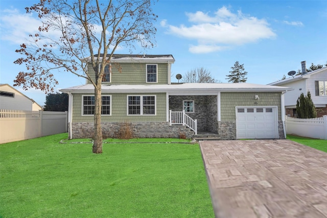 front facade with a garage and a front yard