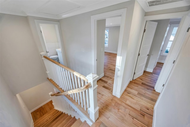 stairs featuring hardwood / wood-style floors