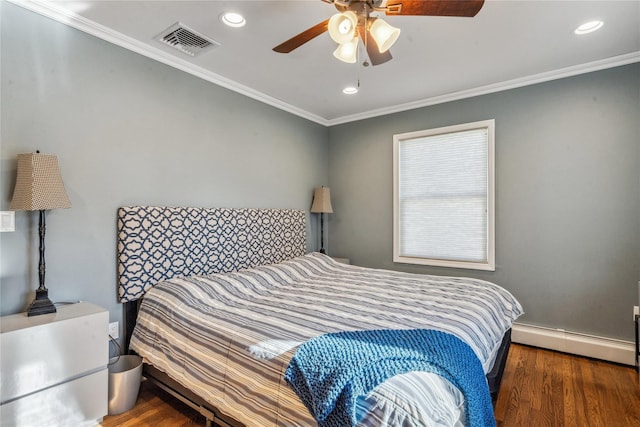 bedroom with baseboard heating, ceiling fan, crown molding, and dark wood-type flooring