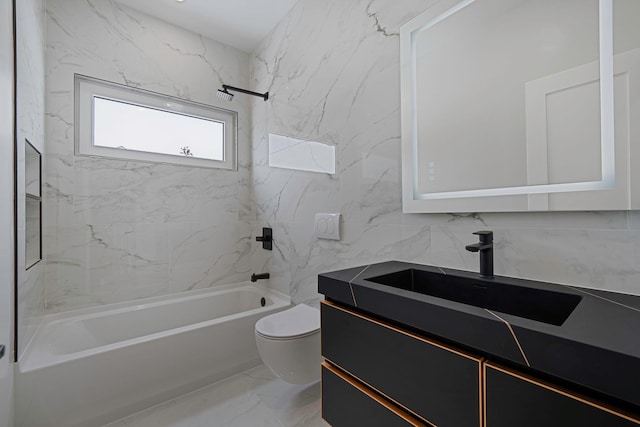 full bathroom with tiled shower / bath, vanity, and toilet