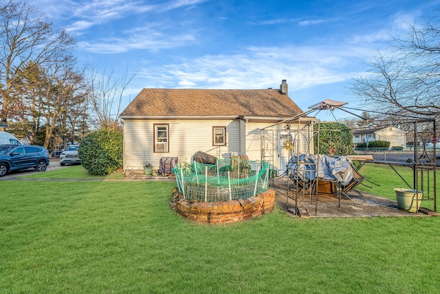 exterior space featuring a gazebo and a yard