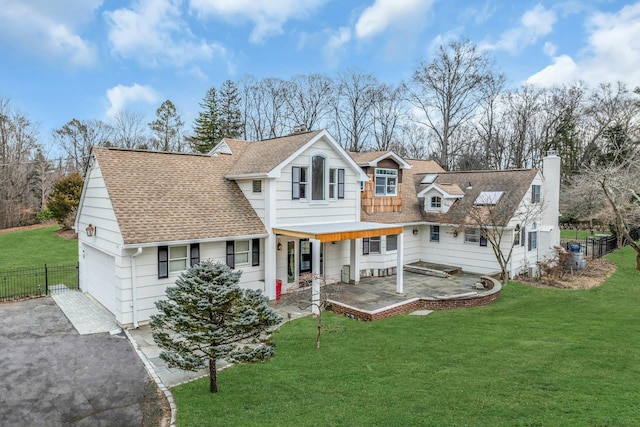 view of front facade with a garage, covered porch, and a front lawn