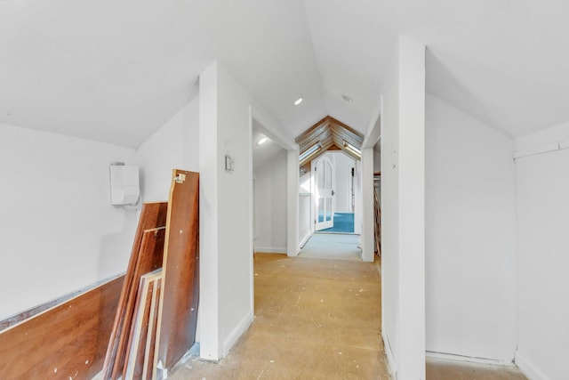 corridor with vaulted ceiling