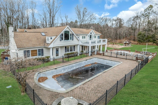 view of swimming pool with a yard and a patio area