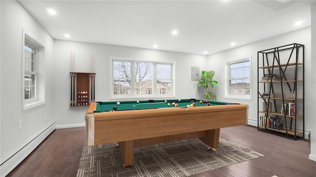 rec room with a baseboard heating unit, pool table, electric panel, and dark hardwood / wood-style flooring