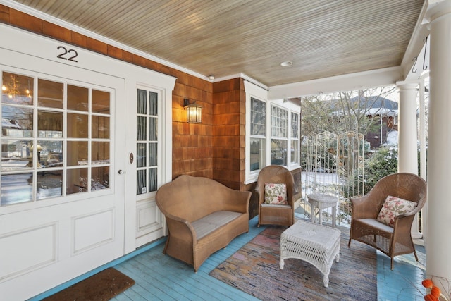 sunroom featuring wooden ceiling