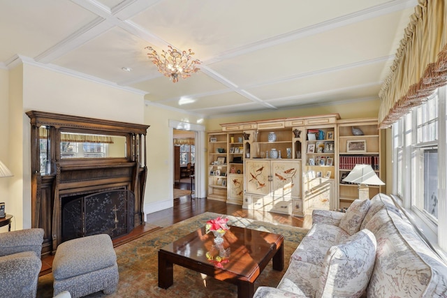 living room featuring coffered ceiling, dark wood-type flooring, and a chandelier