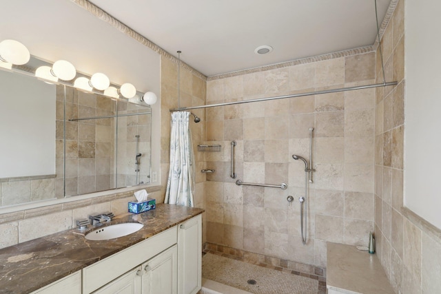 bathroom with vanity, curtained shower, and decorative backsplash