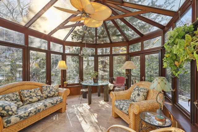 sunroom featuring vaulted ceiling and ceiling fan