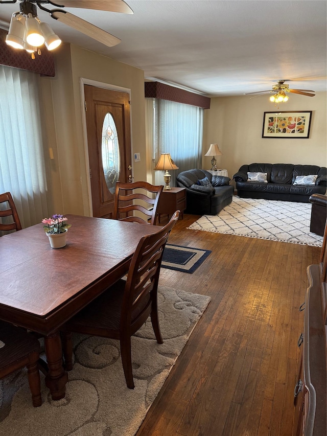 dining room featuring ceiling fan and wood-type flooring