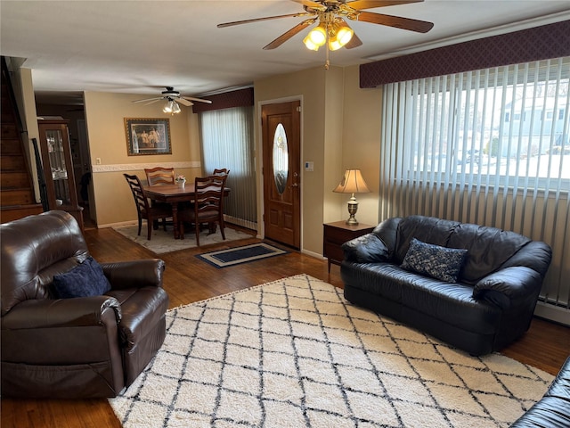 living room with hardwood / wood-style flooring and ceiling fan