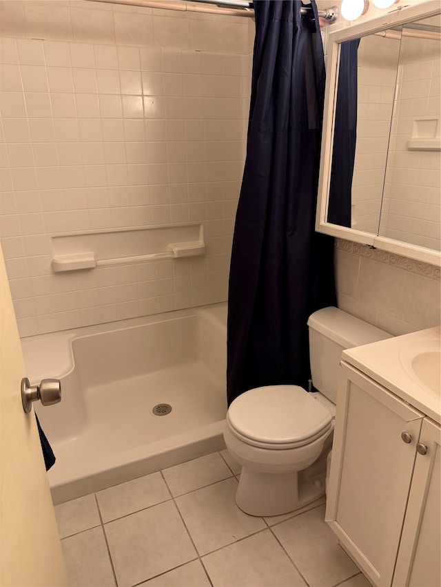 bathroom featuring tile patterned flooring, vanity, a shower with curtain, and toilet