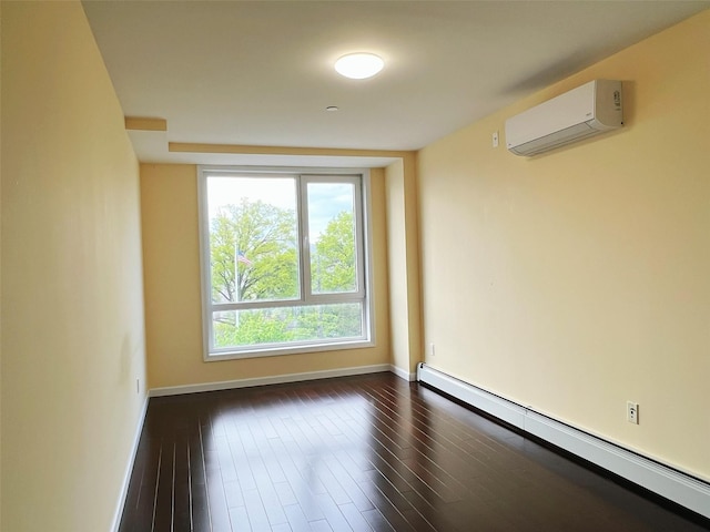 spare room with dark hardwood / wood-style flooring, a wall mounted air conditioner, and baseboard heating