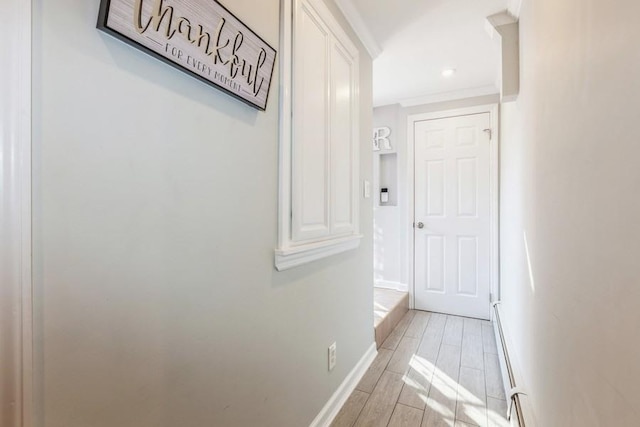 hallway with light hardwood / wood-style floors