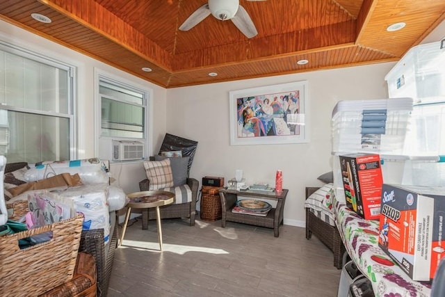 interior space featuring a tray ceiling, cooling unit, and wood ceiling