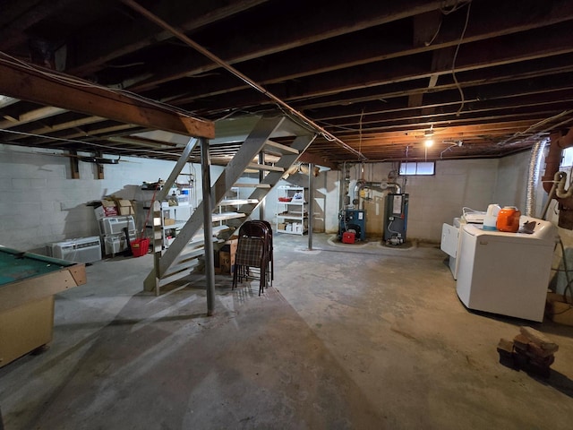 basement featuring separate washer and dryer and water heater