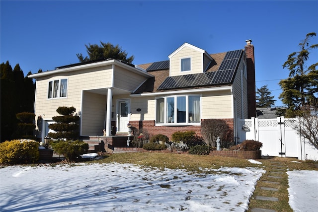 view of front of house with solar panels