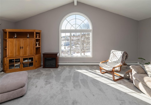 sitting room featuring light carpet, a wealth of natural light, lofted ceiling, and a baseboard radiator