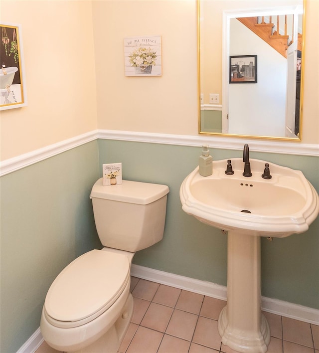 bathroom with tile patterned floors, toilet, and sink