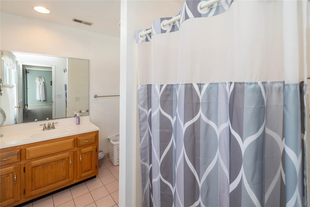 bathroom featuring tile patterned floors and vanity