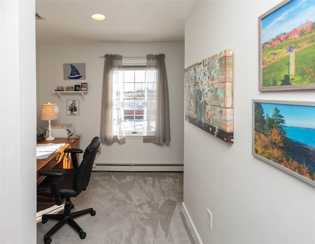 office area with carpet flooring and a baseboard heating unit