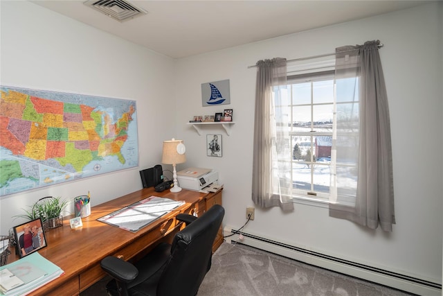 office featuring a baseboard heating unit and a wealth of natural light