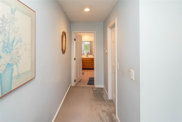 corridor with light colored carpet