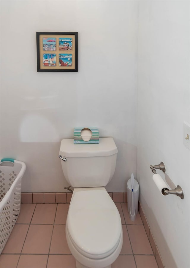 bathroom with tile patterned flooring and toilet