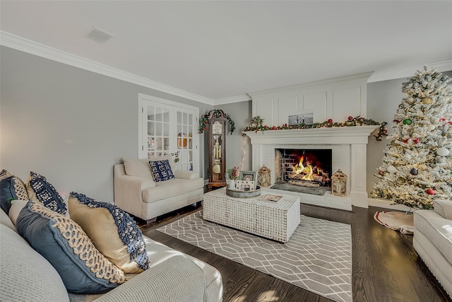 living room featuring crown molding, a brick fireplace, and dark hardwood / wood-style flooring