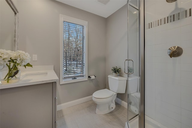 bathroom with vanity, toilet, and walk in shower