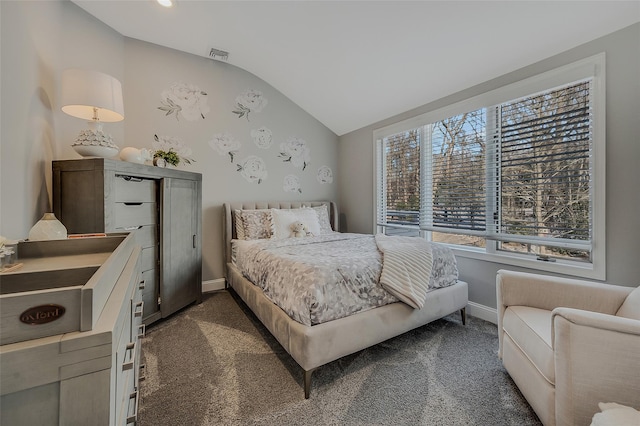 carpeted bedroom featuring vaulted ceiling