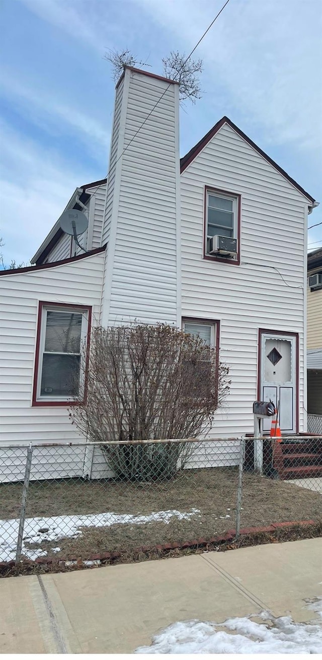 view of side of home with cooling unit