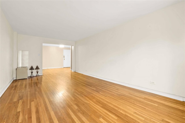 unfurnished room featuring light wood-type flooring