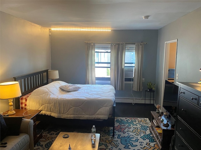 bedroom featuring a baseboard heating unit