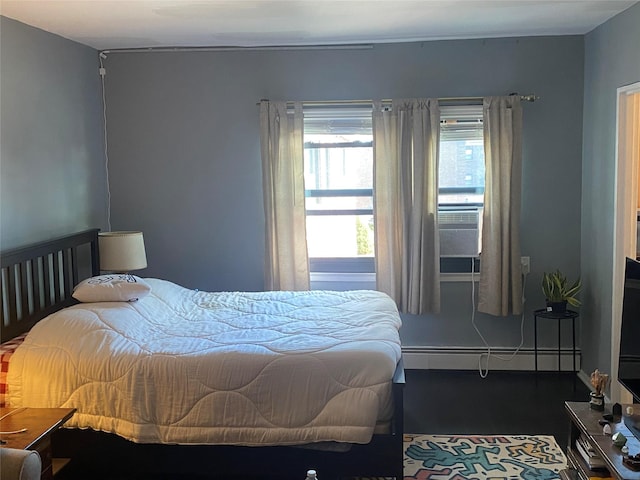 bedroom featuring a baseboard heating unit