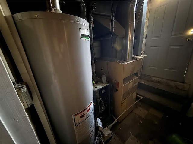 utility room featuring gas water heater