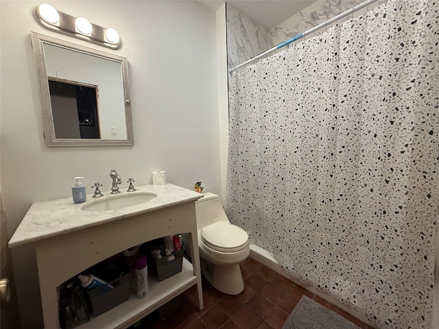 bathroom with walk in shower, vanity, and toilet