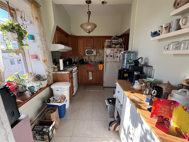 kitchen featuring light tile patterned flooring, white appliances, butcher block counters, and hanging light fixtures