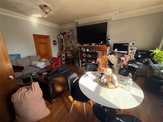 living room with crown molding and hardwood / wood-style floors